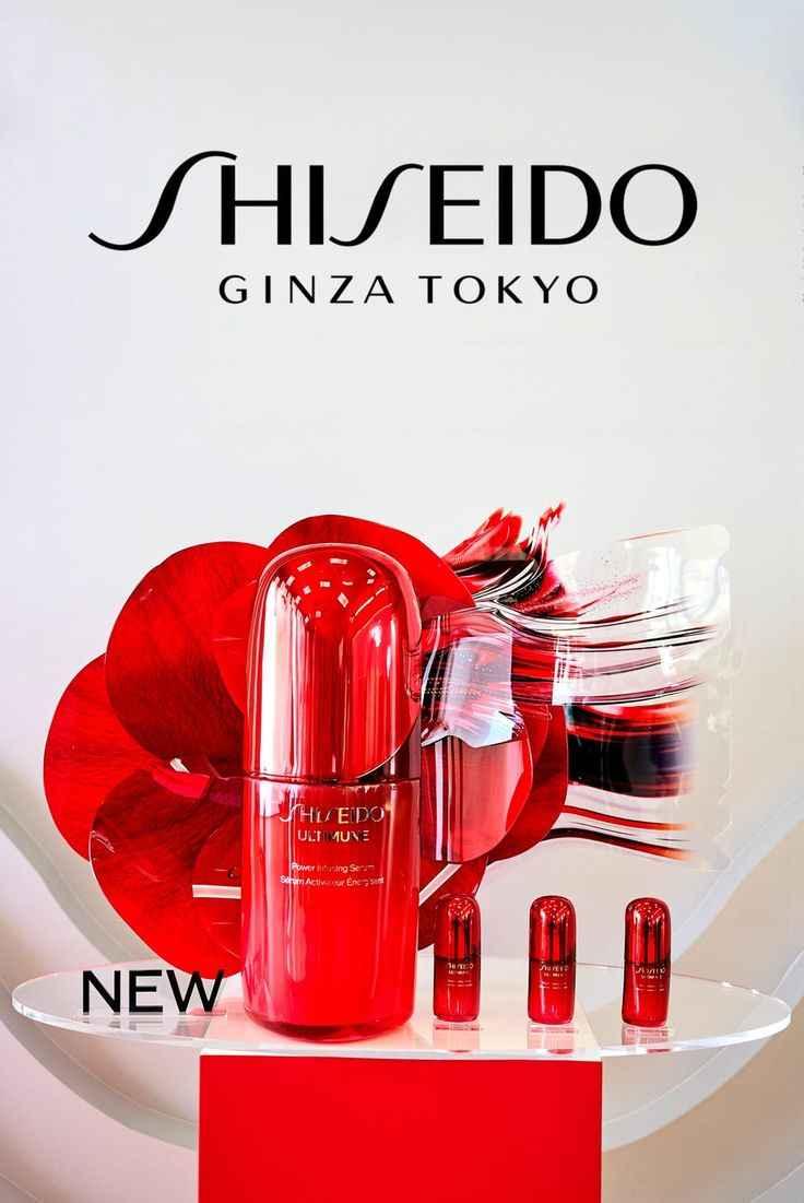 Shiseido Ultimune Power Infusing Serum red bottle with flower background and three smaller bottles on display