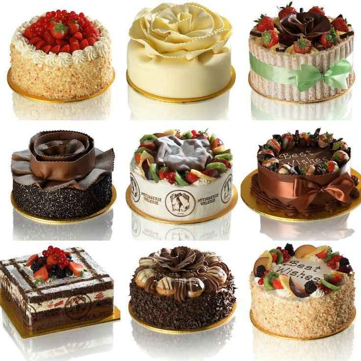 Nine assorted decorative cakes with fruits, chocolate, cream, and detailed toppings on white background