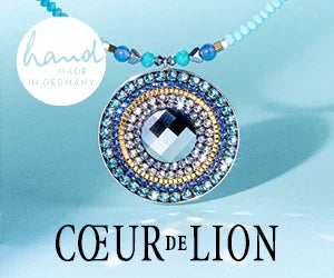 Handmade in Germany Coeur de Lion blue beaded pendant necklace on light blue background