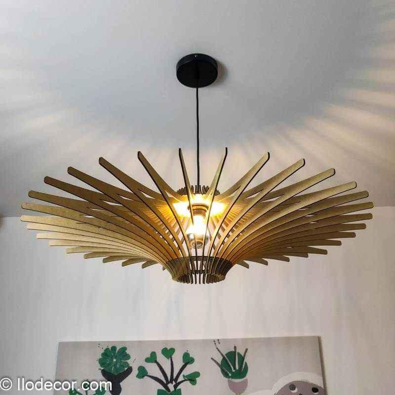 Modern wooden pendant ceiling light fixture with radiating slats casting shadows