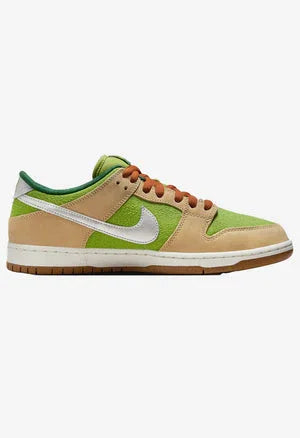 Side view of Nike low-top sneaker in beige suede and green mesh with white swoosh and brown laces