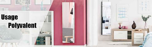 Modern living room with white bookshelf, pink accent wall, slim mirror, wooden sideboard, and cozy chair